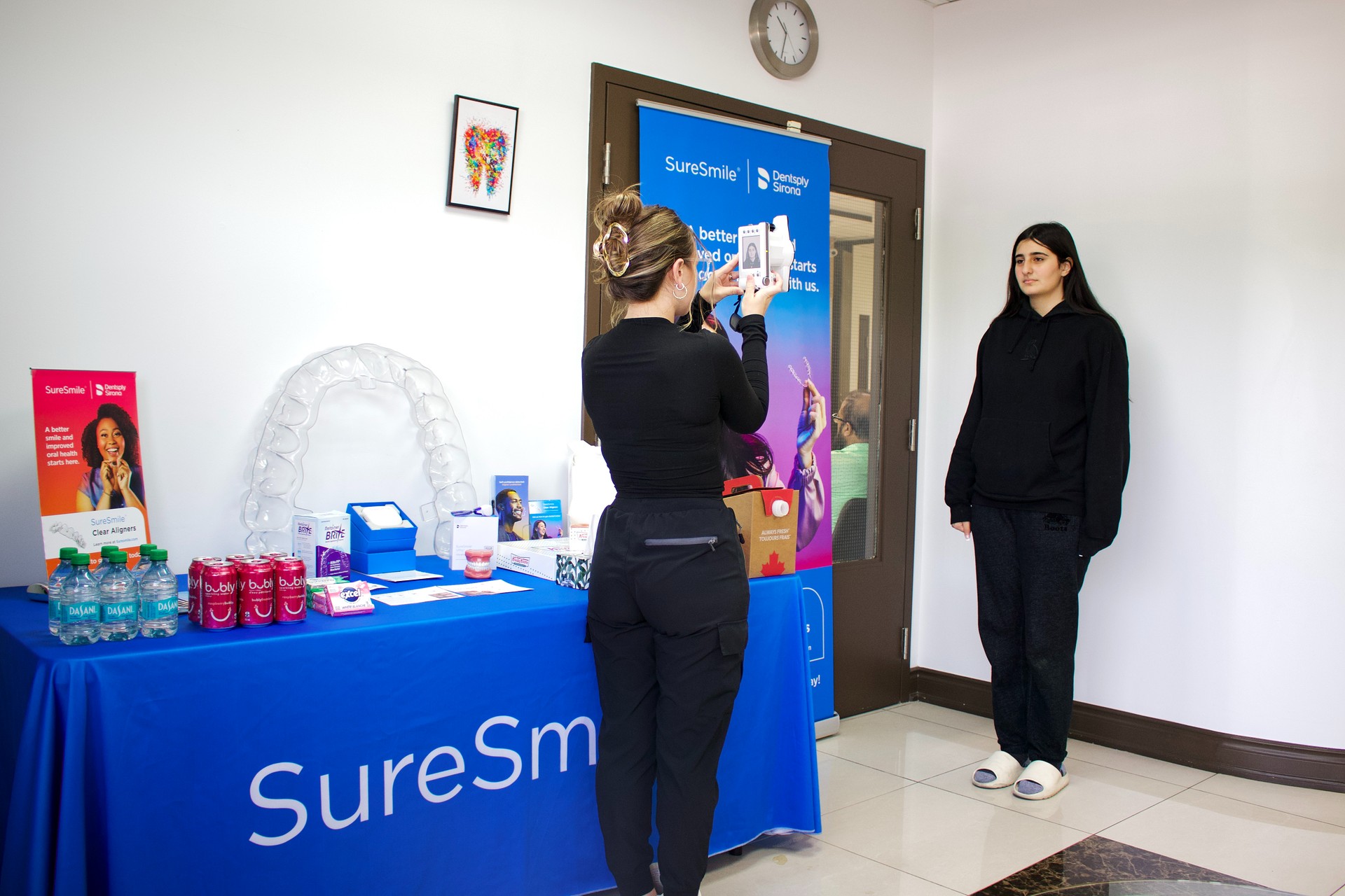 Patient smiling with straightened teeth after SureSmile® Aligners treatment at Hamilton Care Dental Centre, view two