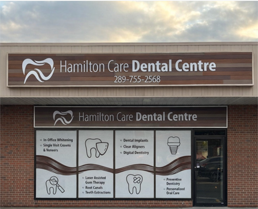 exterior building facade of hamilton care dental centre showing clinic signage and window graphics