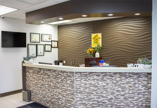 modern reception desk and waiting area at hamilton care dental centre